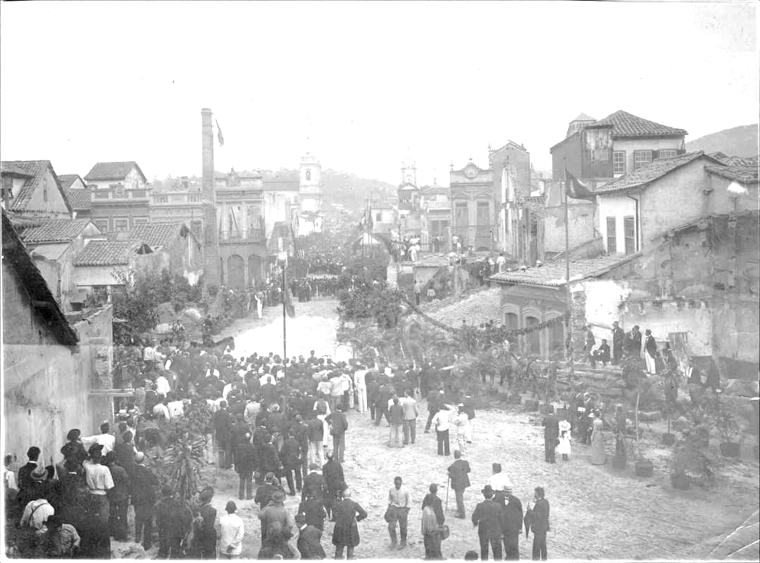 A group of people walking in a street

Description automatically generated