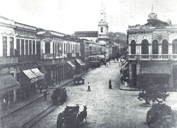 A street with horses and people

Description automatically generated with medium confidence