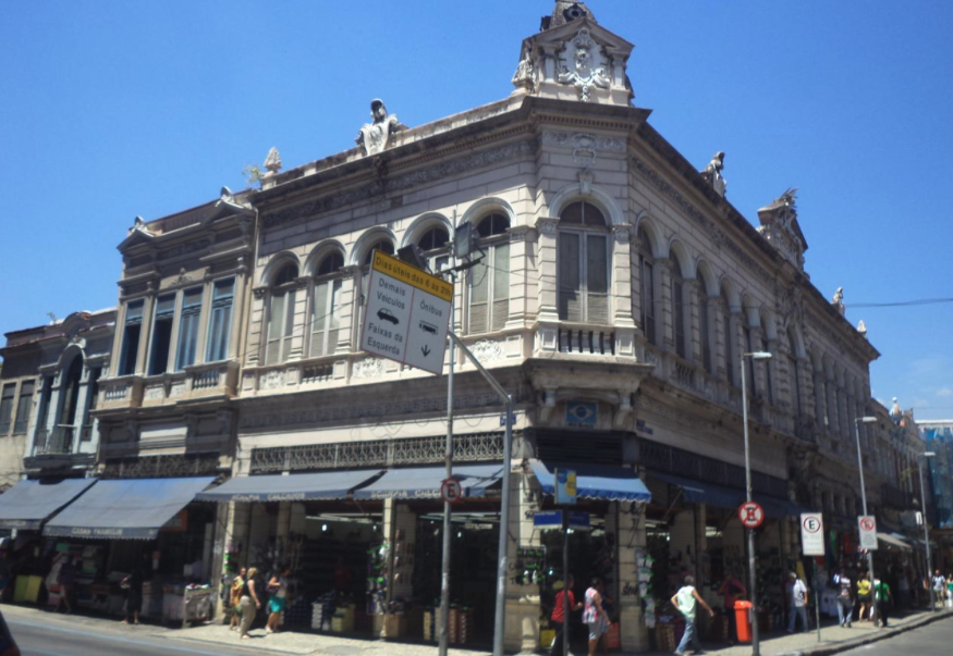 A building with a statue on top of it

Description automatically generated